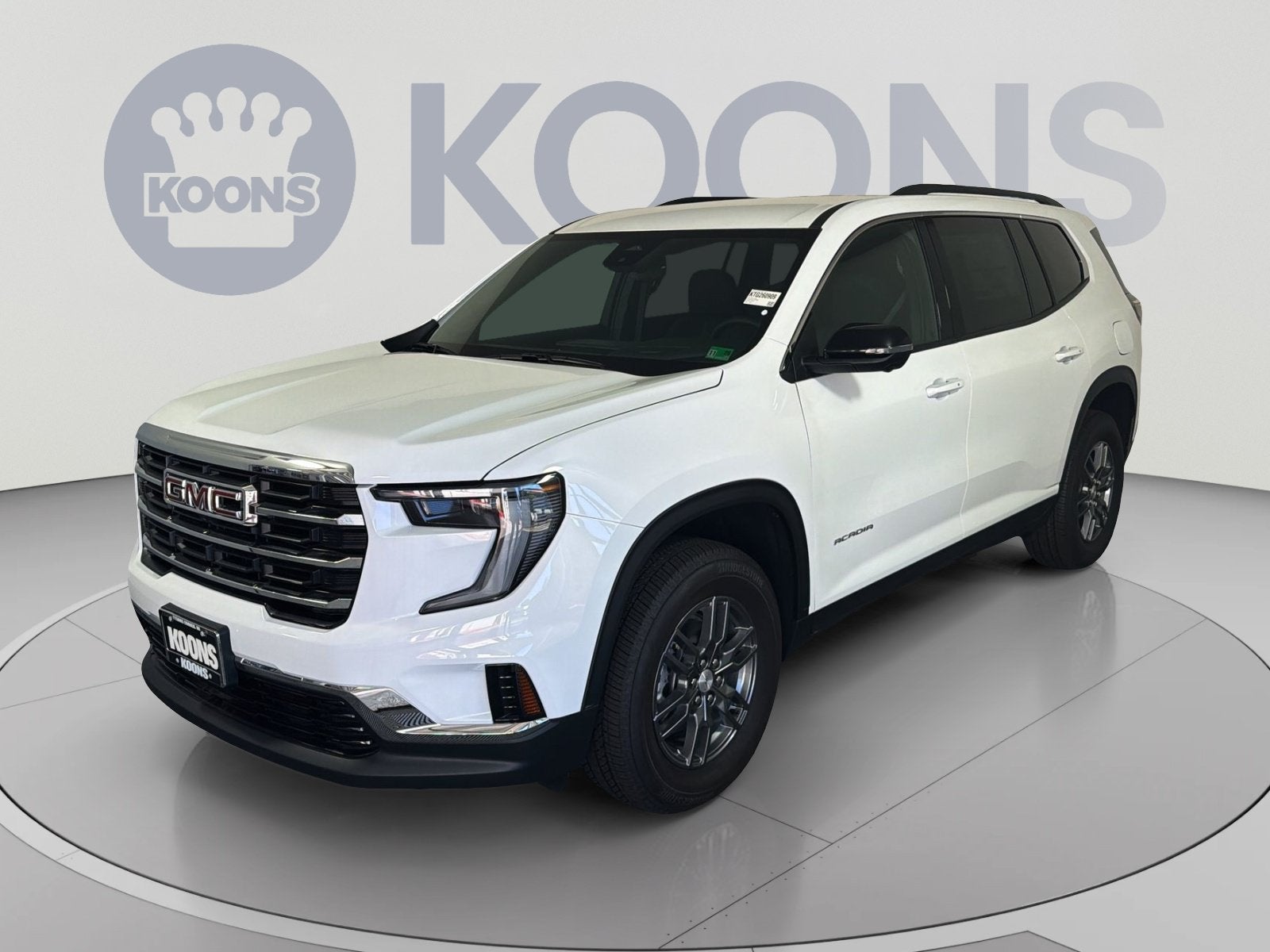2026 GMC Acadia Elevation in Summit White — front three-quarter view