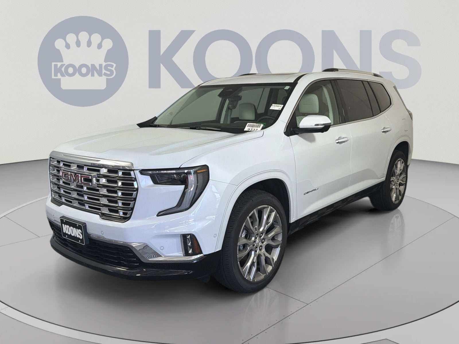 2026 GMC Acadia Denali in Glacier White Tricoat — front three-quarter view