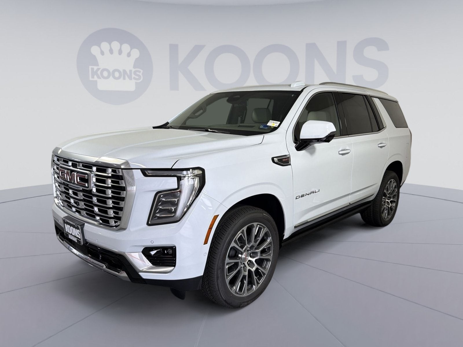 2026 GMC Yukon Denali in Glacier White Tricoat — front three-quarter view