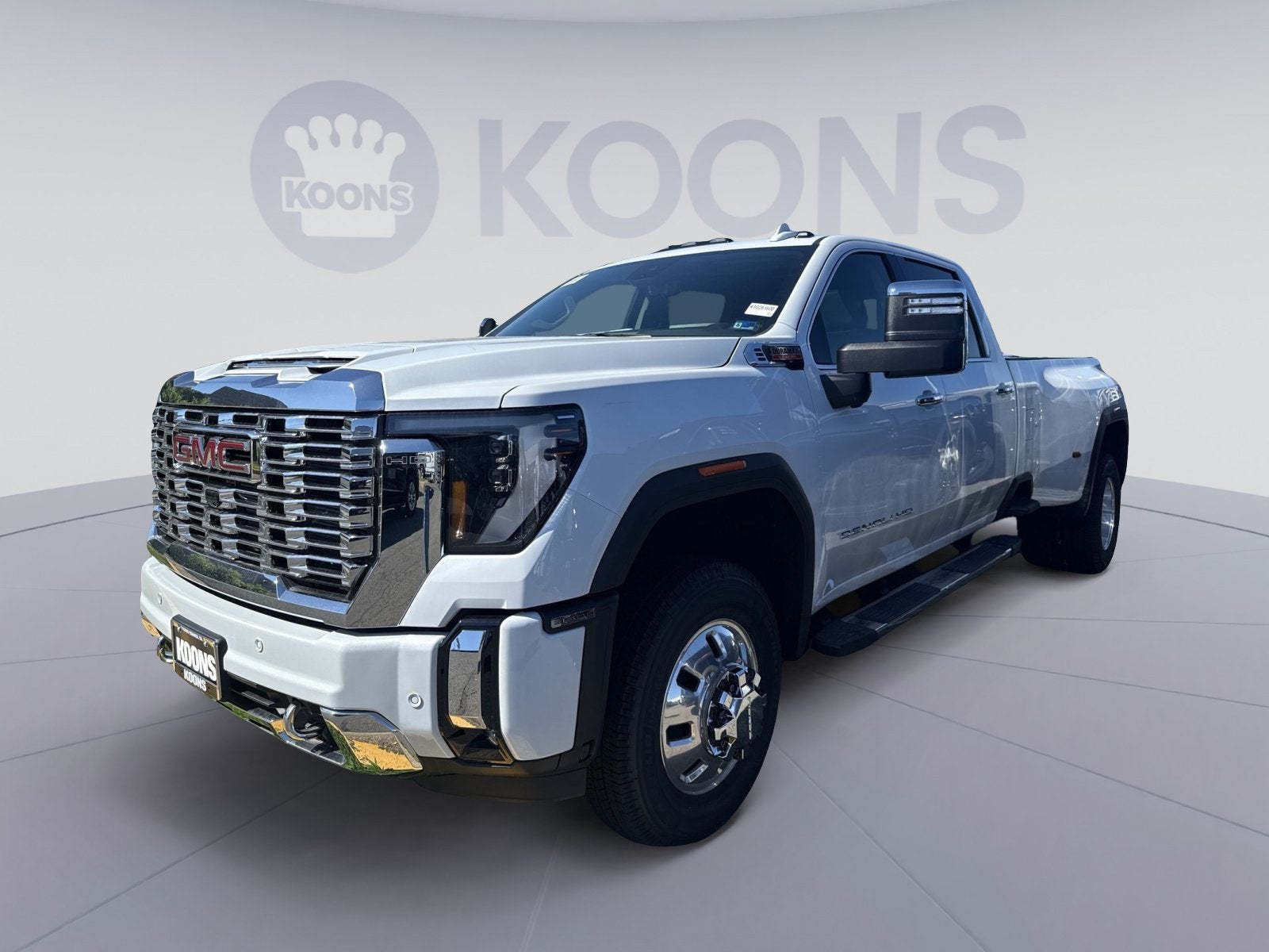 2026 GMC Sierra 3500 HD Denali DRW in Glacier White Tricoat — front three-quarter view