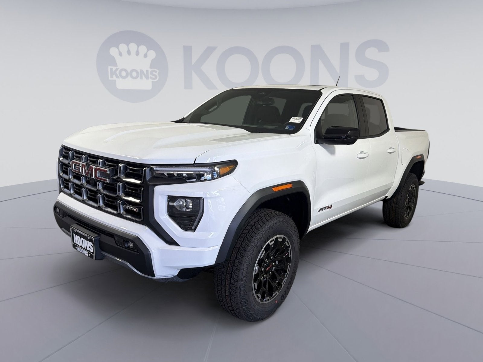 2026 GMC Canyon AT4 in Summit White — front three-quarter view