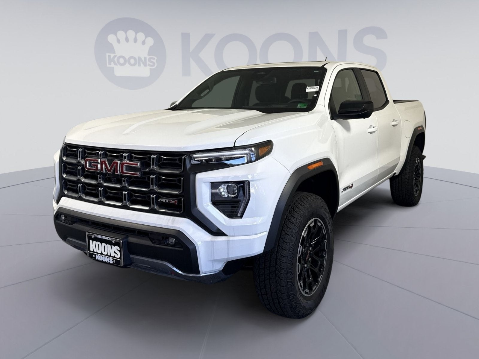 2026 GMC Canyon AT4 in Summit White — front three-quarter view