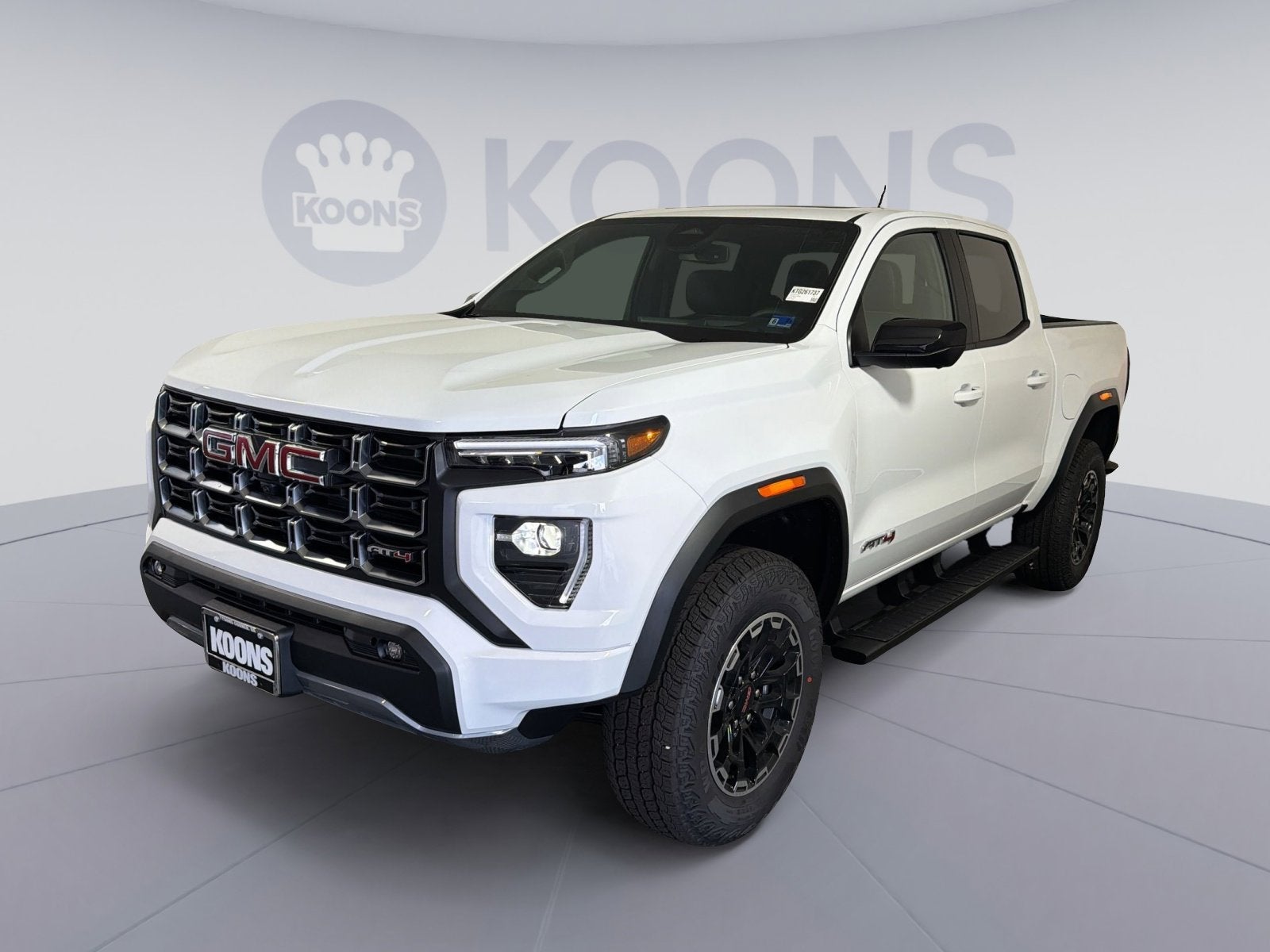 2026 GMC Canyon AT4 in Summit White — front three-quarter view