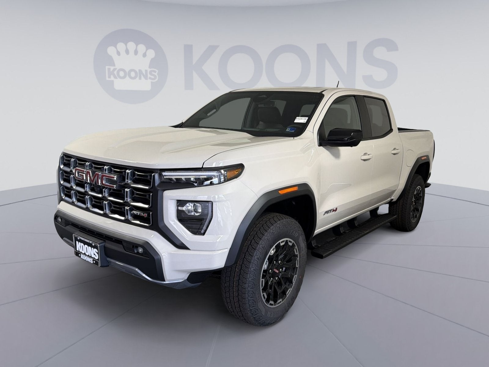 2026 GMC Canyon AT4 in Coastal Dune — front three-quarter view