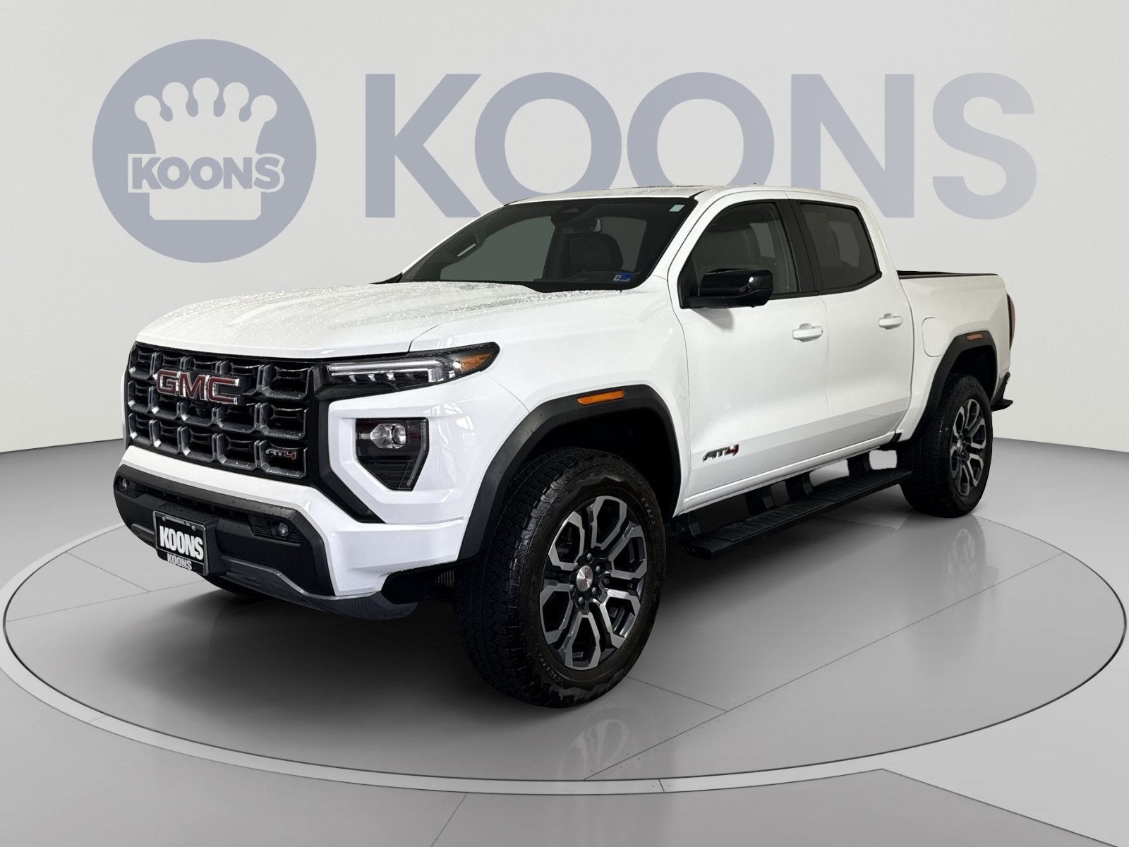 2024 GMC Canyon AT4 in Summit White — front three-quarter view