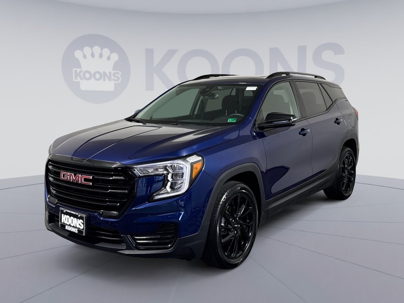 2023 GMC Terrain SLE in Marine Metallic — front three-quarter view