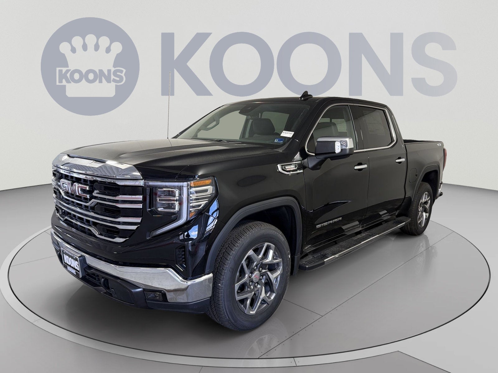 2026 GMC Sierra 1500 SLT in Onyx Black — front three-quarter view