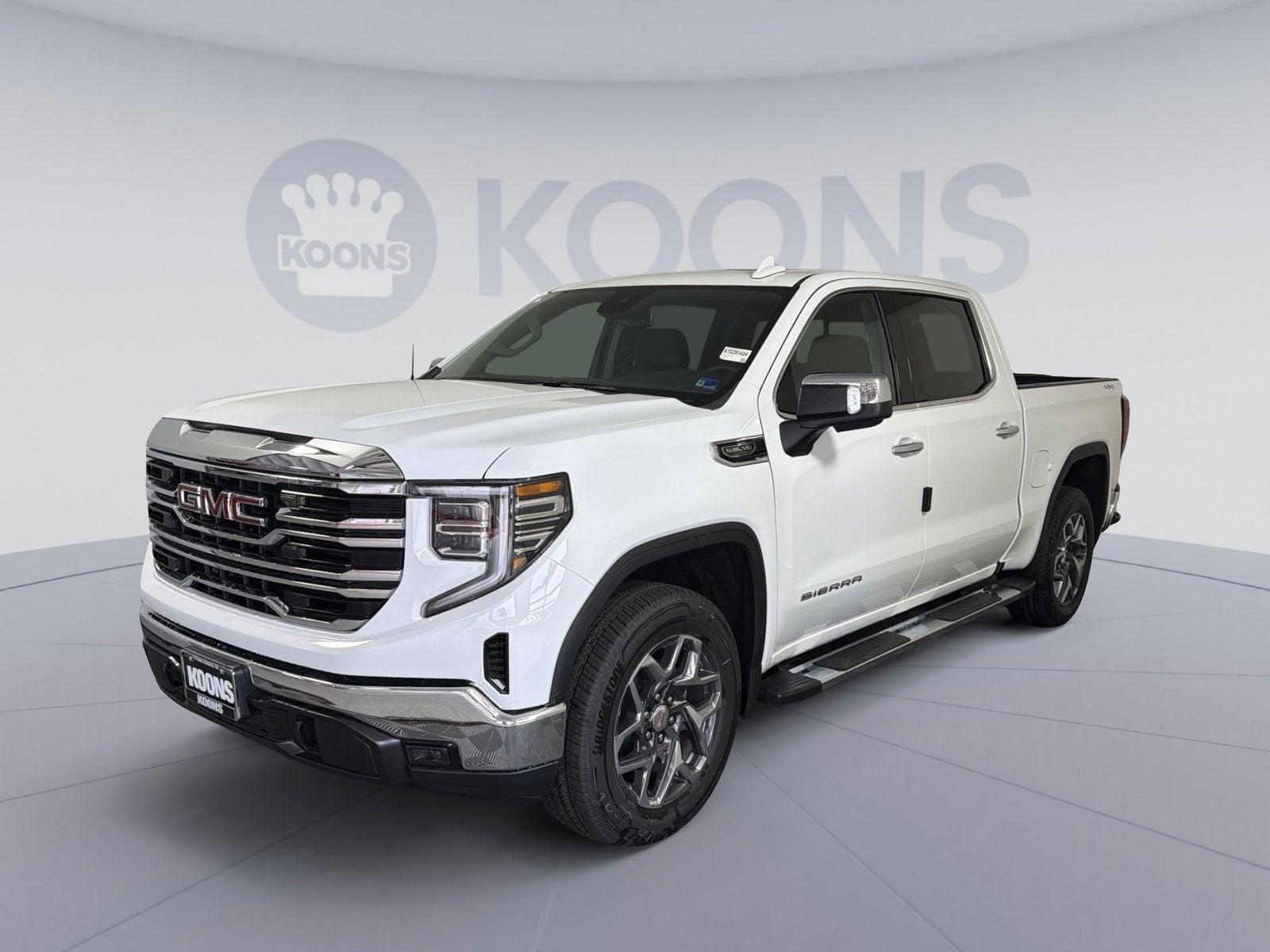 2026 GMC Sierra 1500 SLT in Summit White — front three-quarter view