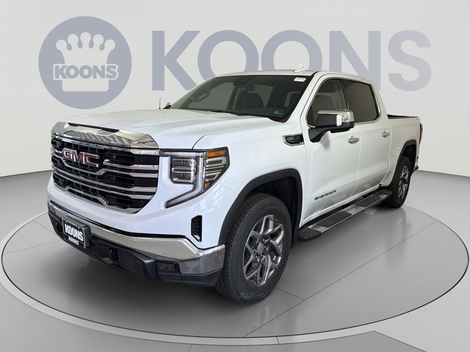 2026 GMC Sierra 1500 SLT in Glacier White Tricoat — front three-quarter view