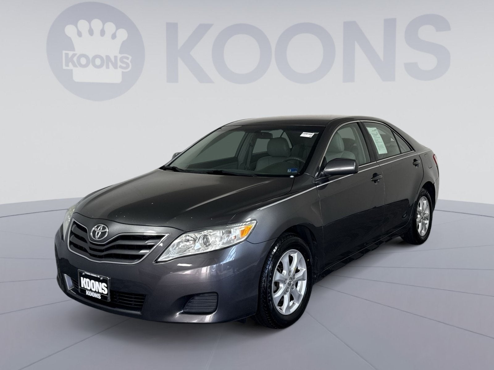 2011 Toyota Camry LE in Magnetic Gray Metallic — front three-quarter view