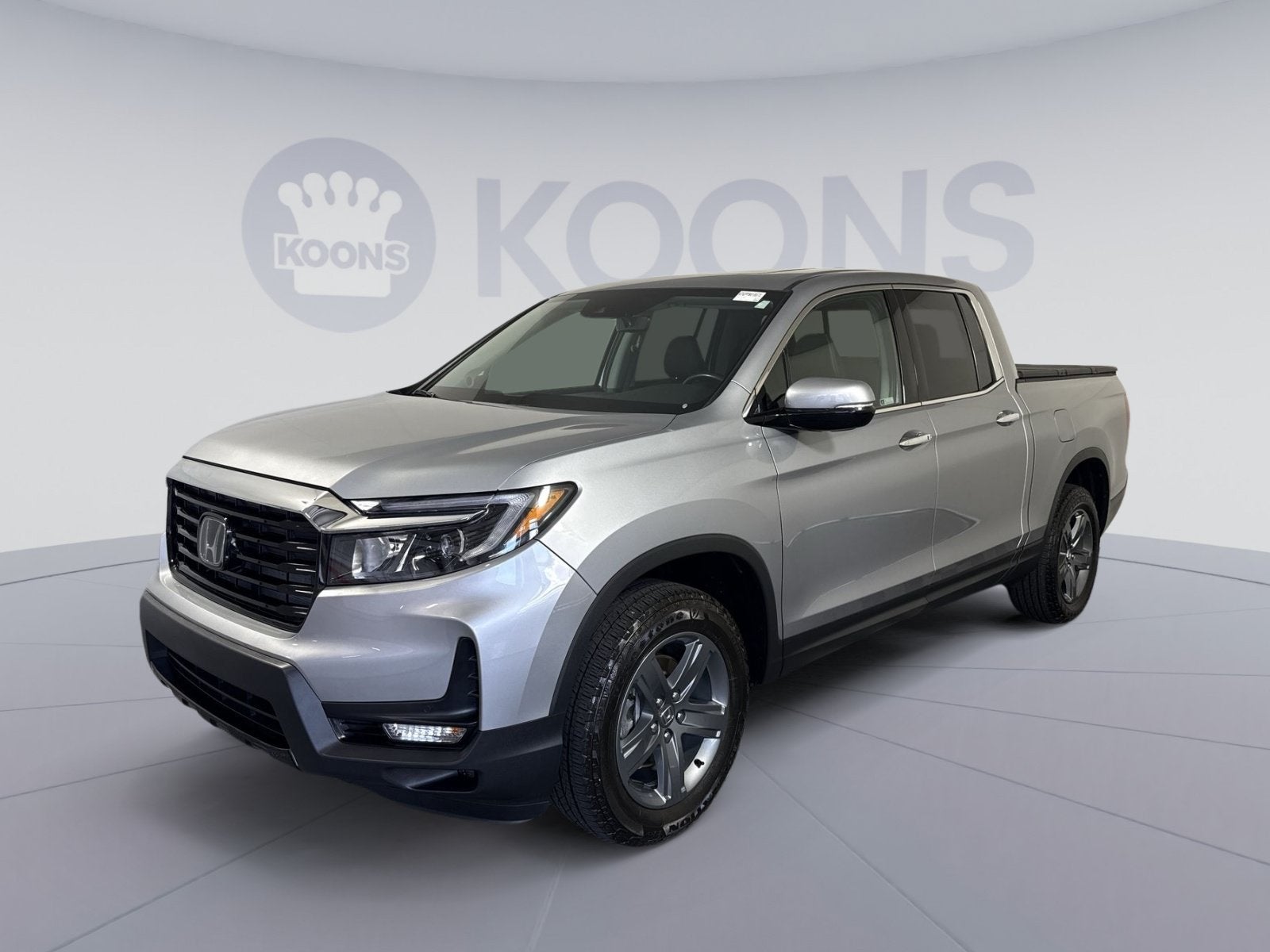 2023 Honda Ridgeline RTL-E in Silver — front three-quarter view